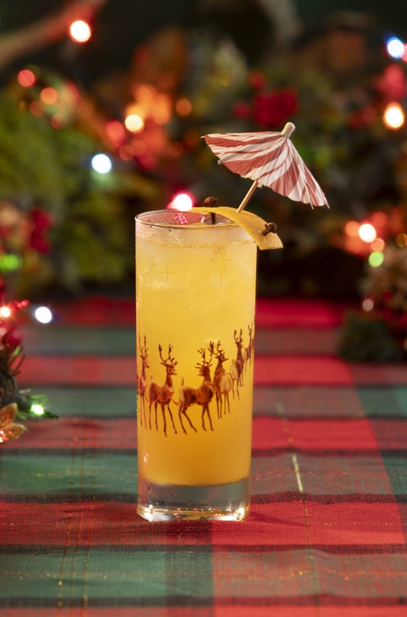 The Ginger Bell Rock in a tall reindeer-printed glass with a paper umbrella.