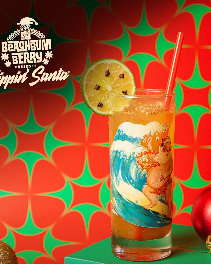 A Sippin&rsquo; Santa tiki mug holding a dark rum cocktail.