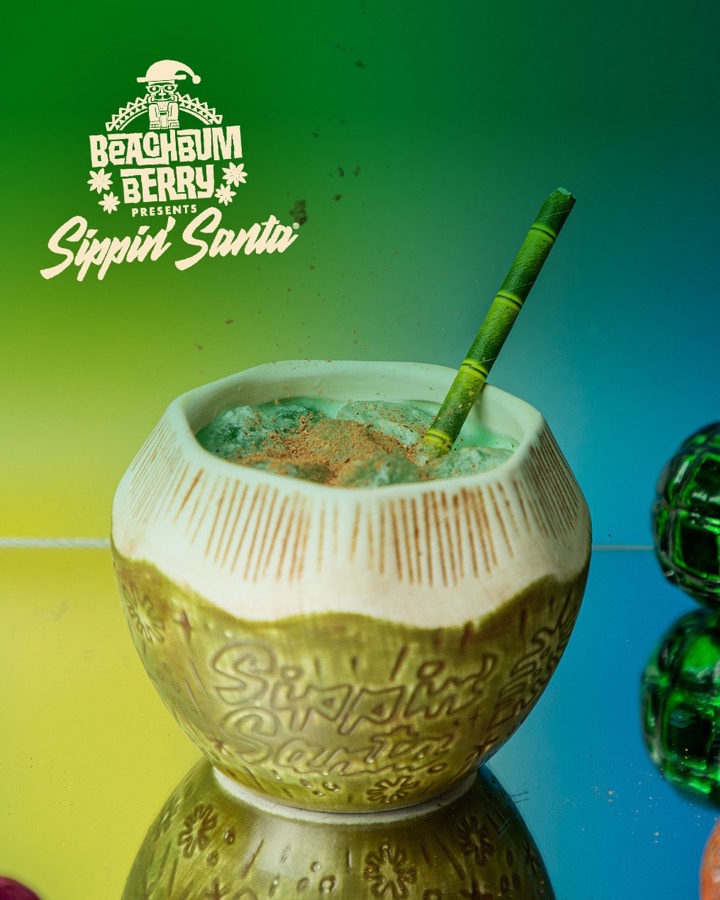 A pale tropical zero-proof drink in a Sippin&rsquo; Santa vessel.