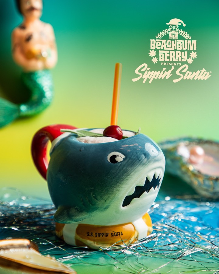 A bright red tiki cocktail in a Sippin&rsquo; Santa vessel.