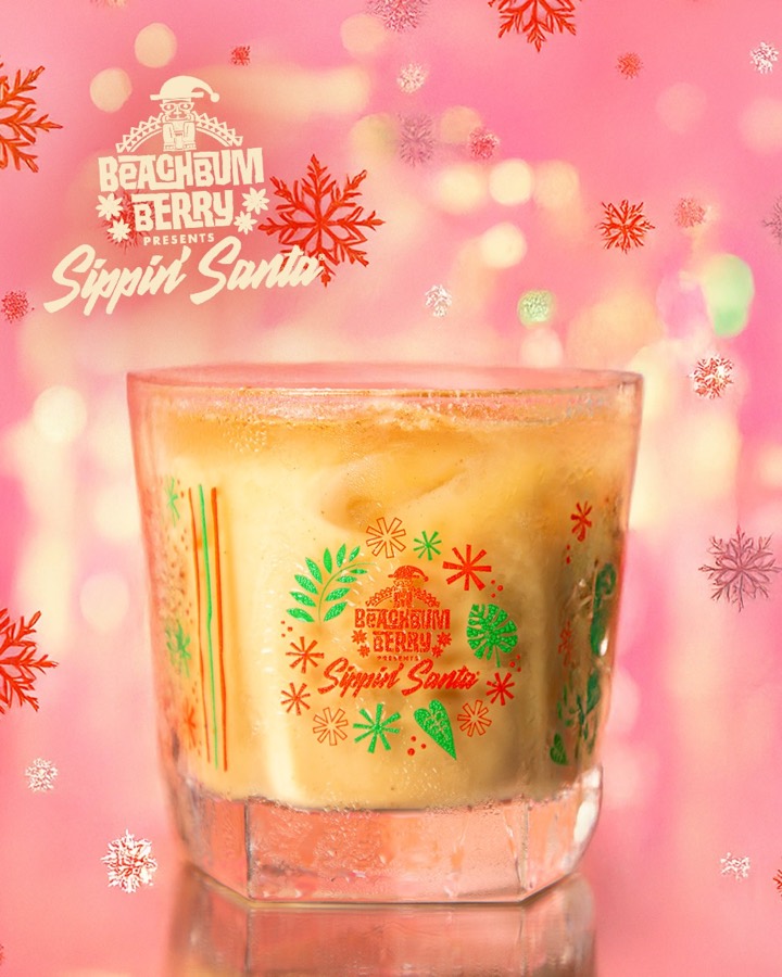 A coffee-coloured cocktail over ice in a Sippin&rsquo; Santa glass.