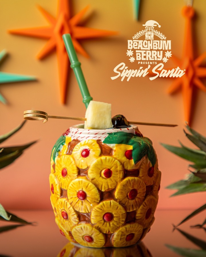 A Sippin&rsquo; Santa cask mug filled with a pineapple cocktail.