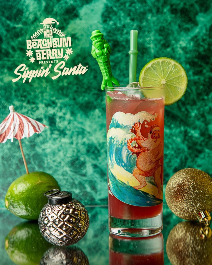A red zero-proof sling in a tall Sippin&rsquo; Santa glass.