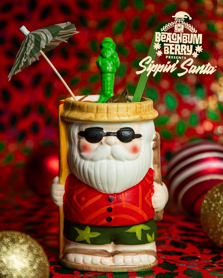The signature Sippin&rsquo; Santa mug holding the house cocktail.